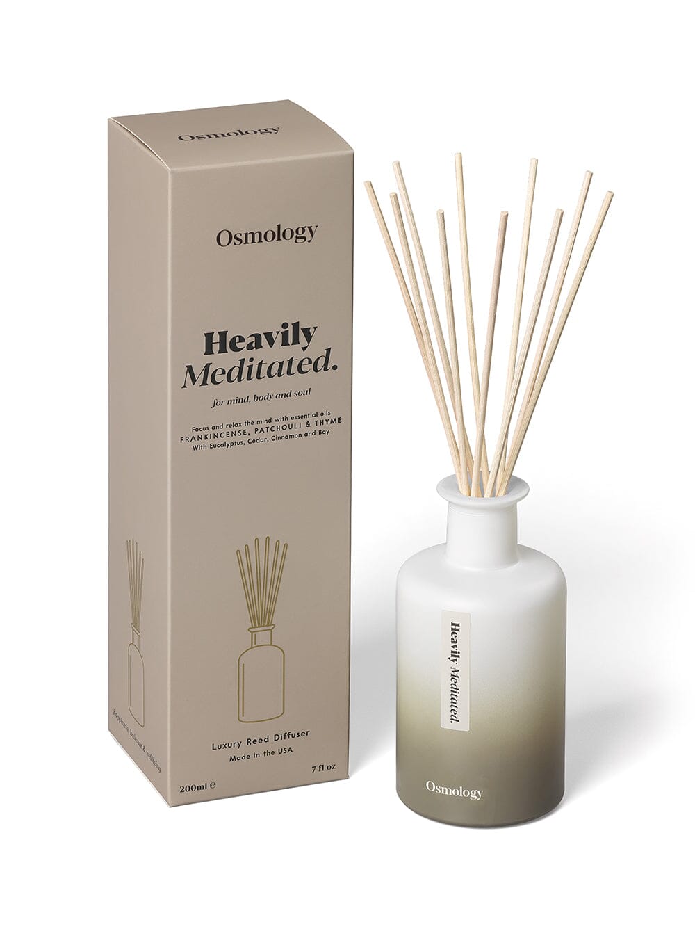 Osmology heavily meditated reed diffuser next to product packaging on a white background