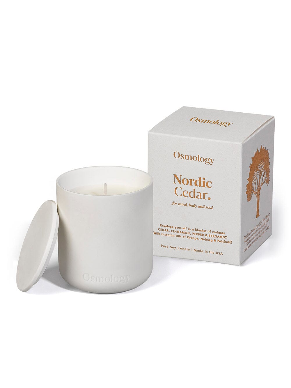 Nordic Cedar candle displayed next to product packaging