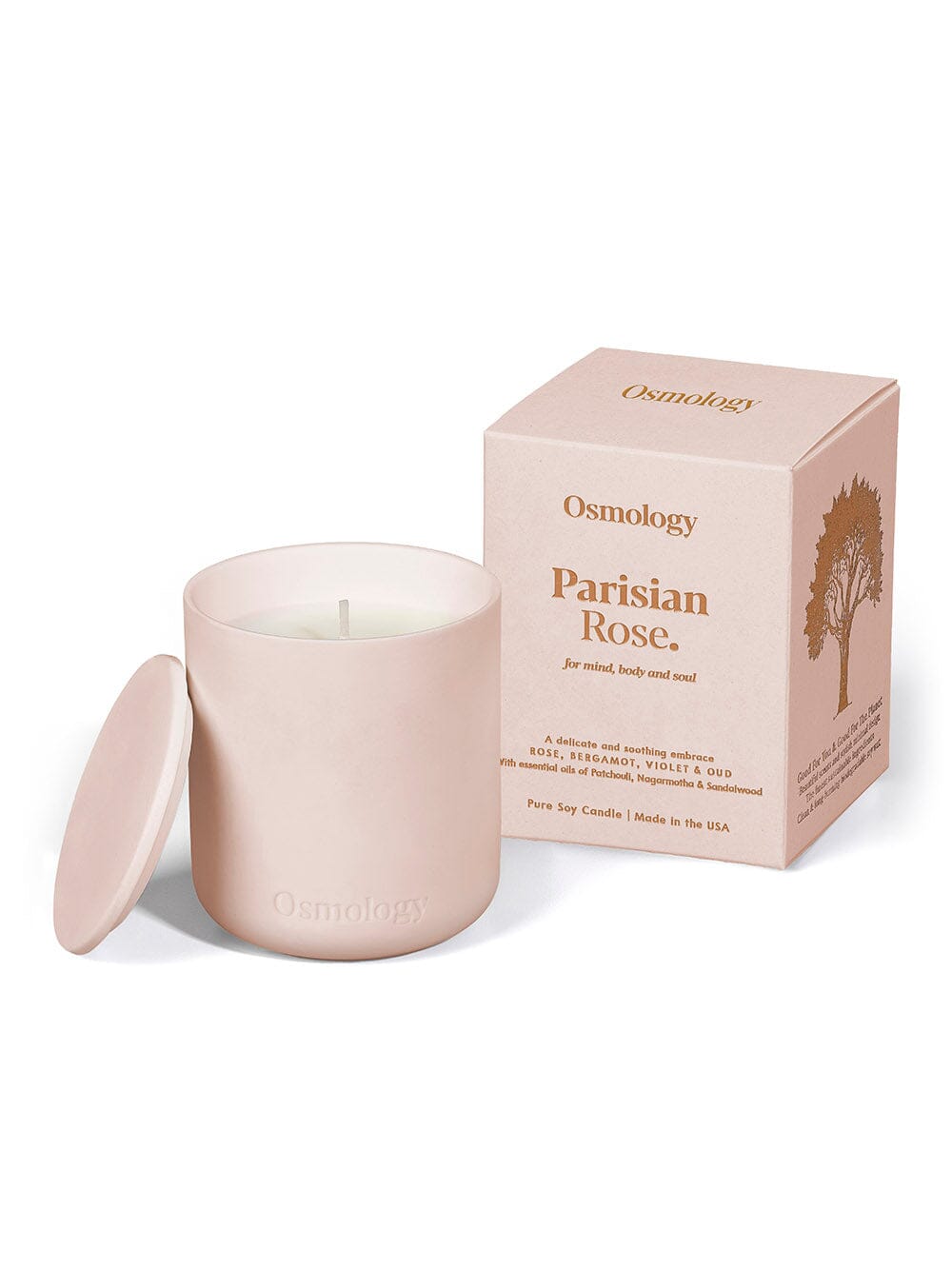 osmology pink ceramic candle next to box packaging